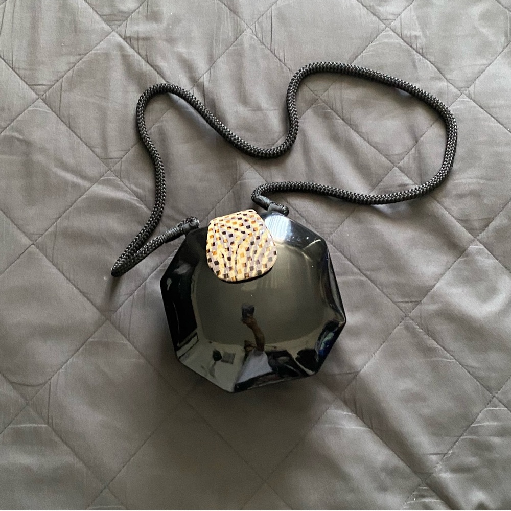 Signature Black Octagonal Crossbody Bag with Textured Accent